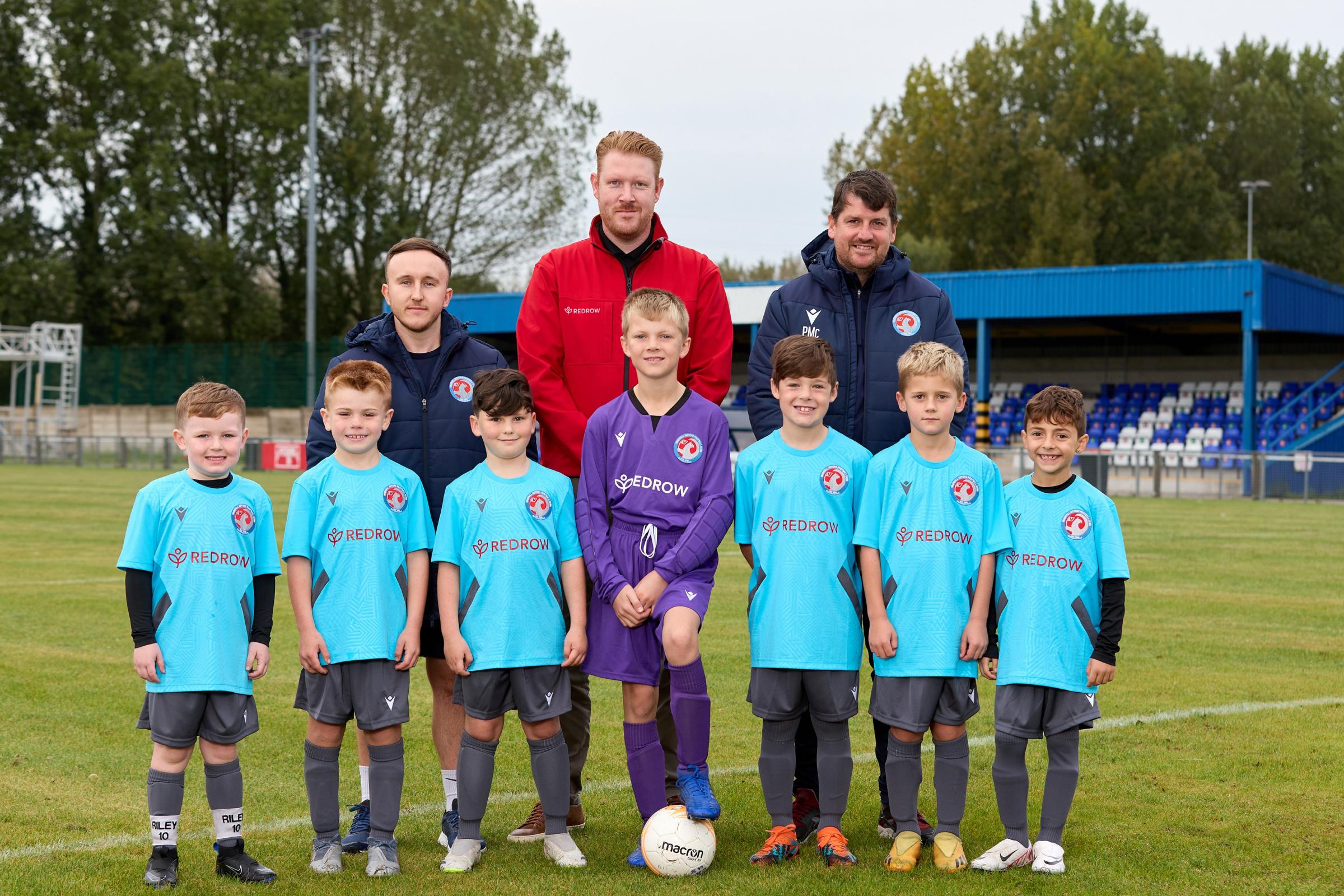 Coach Rhys Foster, Redrows Chris Edwards and coach Paul McDonnell with the Vauxhall Cavaliers Under 8s team.
