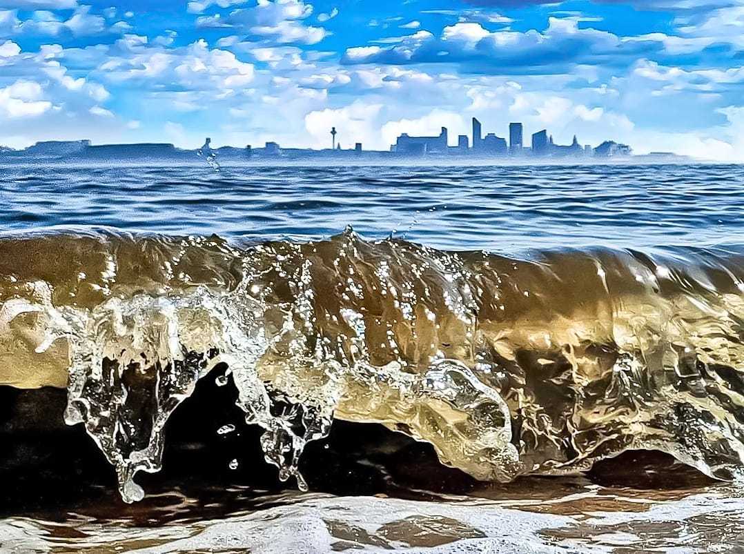 Golden waves on New Brighton beach by Kimberley Phillips