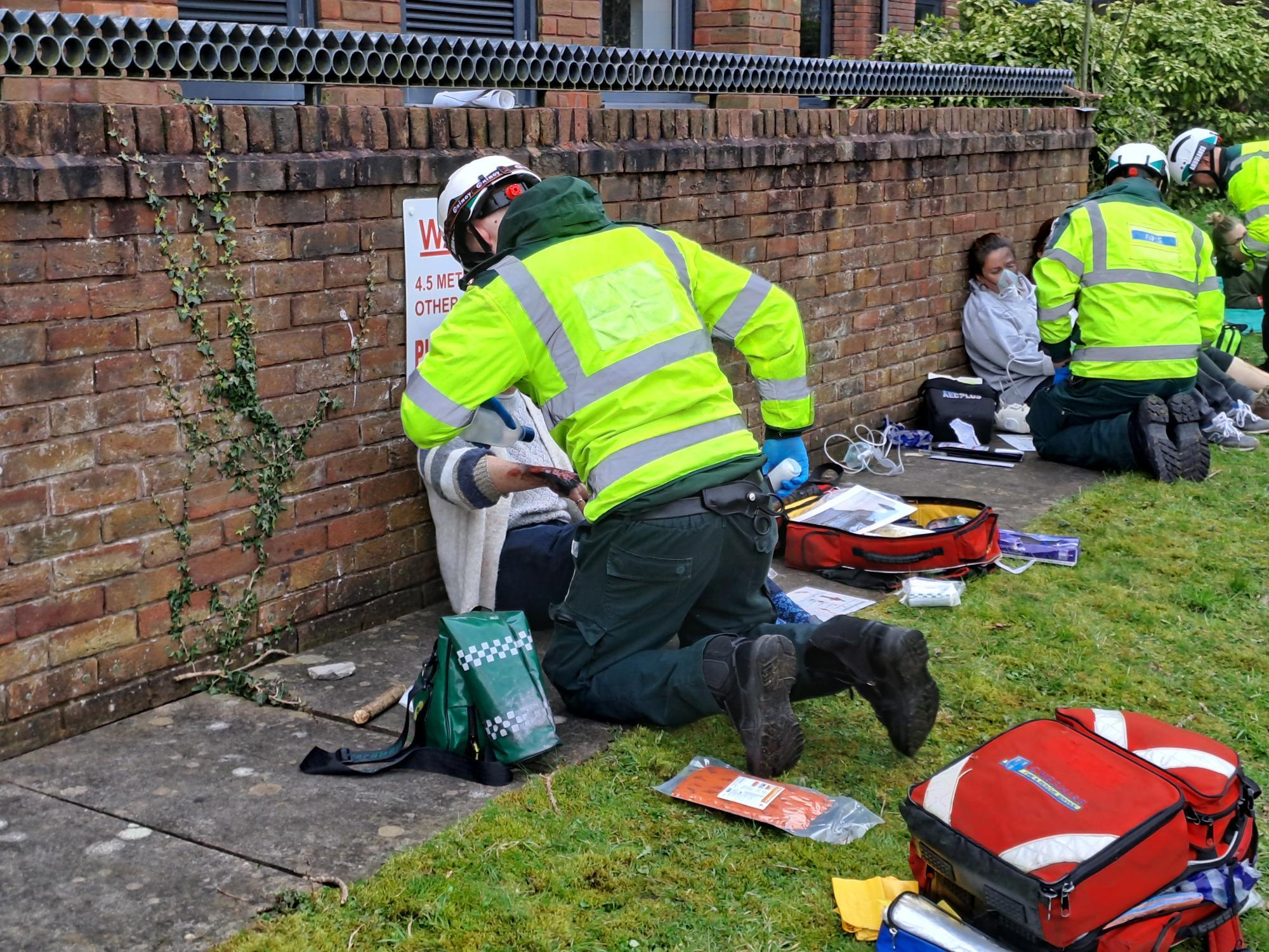 Casualties are treated by paramedics at the site of the emergency exercise.