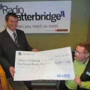 Ian Grant receives the cheque