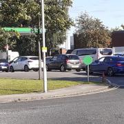 A large queue for fuel at Asda on the Croft Retail Park in Bromborough. Photo: Craig Manning