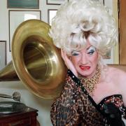Paul O'Grady, as Lily Savage, at home in south London.
