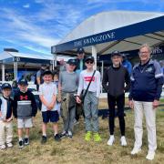 Members of Wirral Golf Academy with founder Angela Dale outside the Swing Zone at The Open in Hoylake 2023