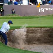 Rory McIlroy escaped trouble on the last hole at the Open