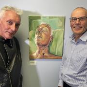 John Hyatt (left), Prof Simon Rogers (right) with John’s post-surgery self-portrait called ‘The Stoic’