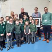 Andy McCluskey with pupils at Great Meols Primary School during - including the competition's winner - Winnifred Bates - during the special assembly on Tuesday, January 8. Their work will be on display in the red phone box over next 12 months