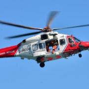 A coastguard helicopter airlifted a man from the water