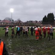 Ashville and Droylsden players following the abandonment of their game