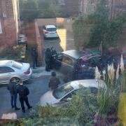 Armed police outside a property on Alexandra Road in Birkenhead