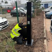 An electric vehicle charging point being inspected at Stiebel Eltron's Bromborough headquarters
