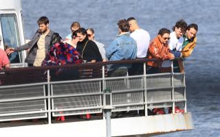 The cast and crew were spotted on board a ferry