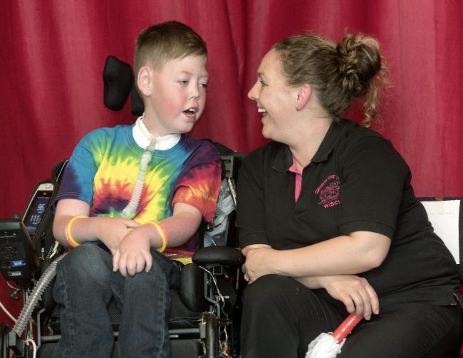 Scott Howell with carer Carolyn during the leavers' assembly. Pictures: Geoff Davies
