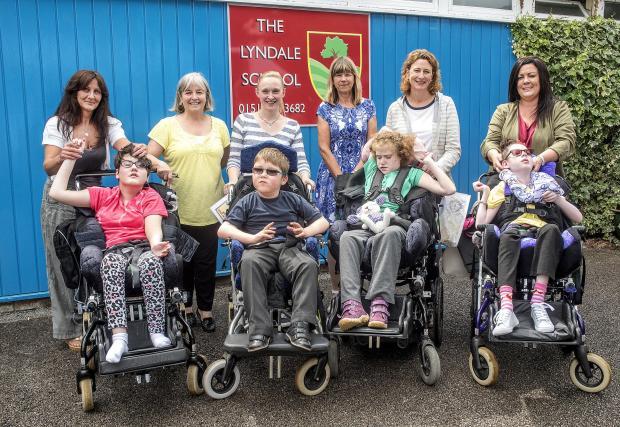 FLASHBACK: From Left: Dawn Hughes and daughter Ellie, Jan Pickin, Chrissie Brie and son Alex, headteacher Kim Owen, Zoe Anderson and daughter Lily, Emma Leadbetter and daughter Neave following the leavers' assembly in July 2016. Picture: Craig Manning